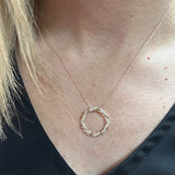 10K Yellow Gold 1/4 Carat Total Weight Diamond Twisted Infinity Circle Pendant - 18" Chain