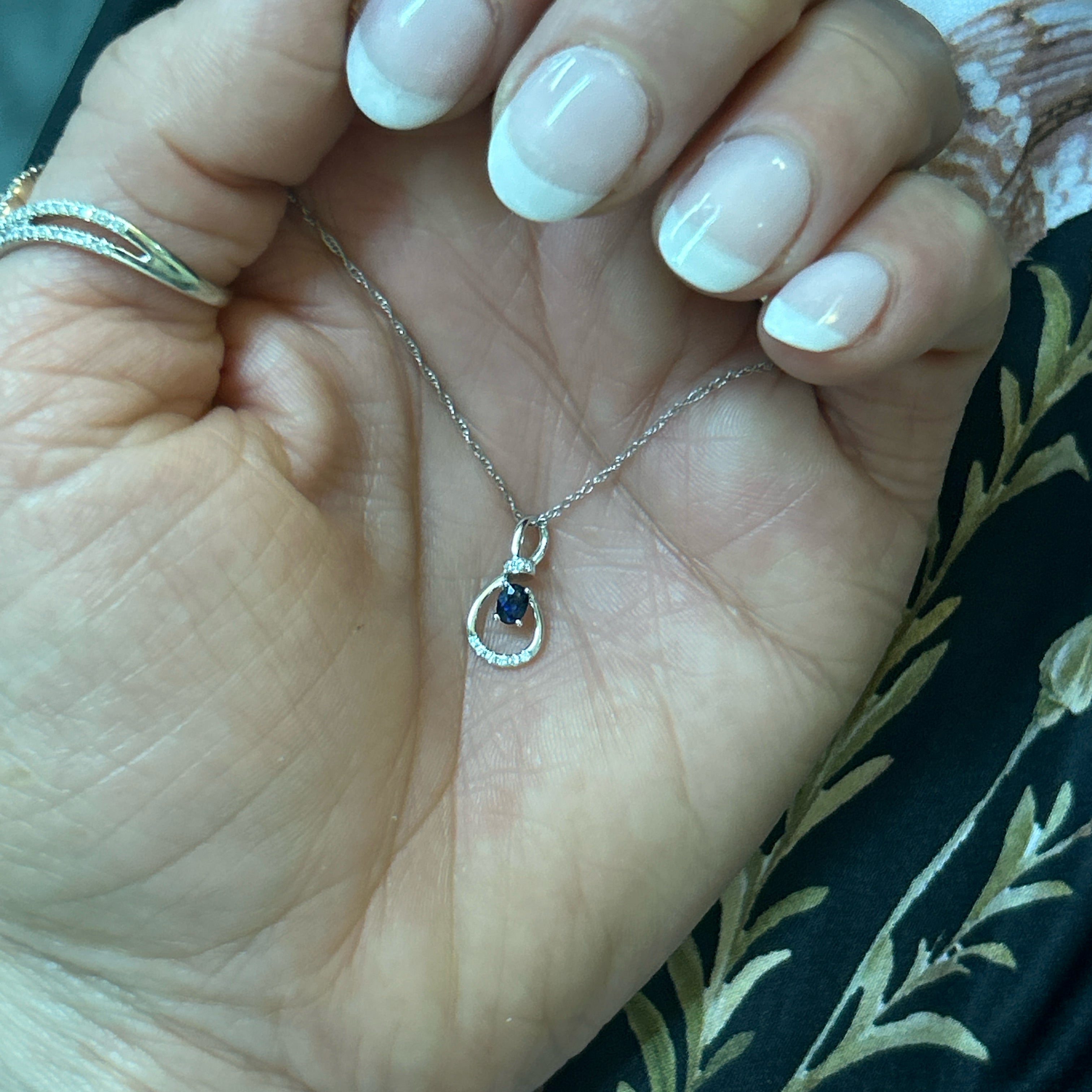 14K White Gold 0.19CT 3x4mm Oval Sapphire and 0.034 Carat Total Weight Diamond Infinity Style Pendant