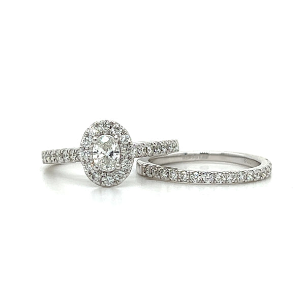 14K White Gold 1.00 Carat Total Weight Oval Halo Diamond Bridal Wedding Engagement Ring Set with .25CT 5x3mm Diamond Center and Peekaboo Diamond in the Gallery of Ring.
